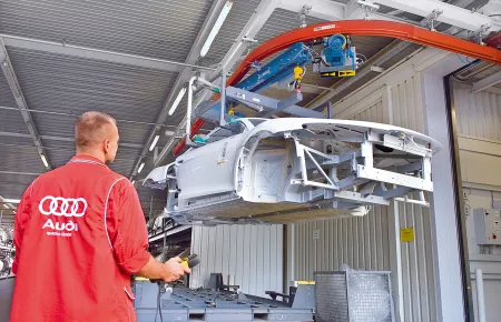 KBK suspension monorail with radio-controlled travelling hoist for transporting car bodies in automotive production
